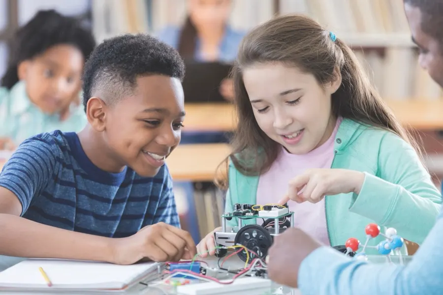 Two students collaborating on a hands-on classroom project